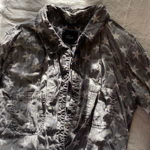 Soft denim long sleeved button up top with white stars.